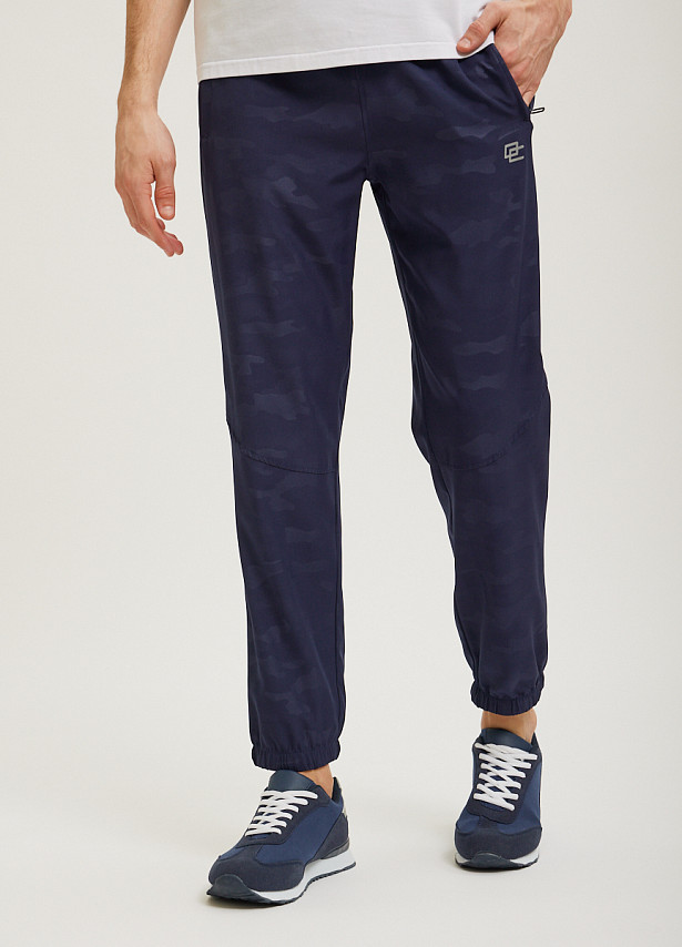 Синие спортивные брюки Overcome с принтом камуфляж